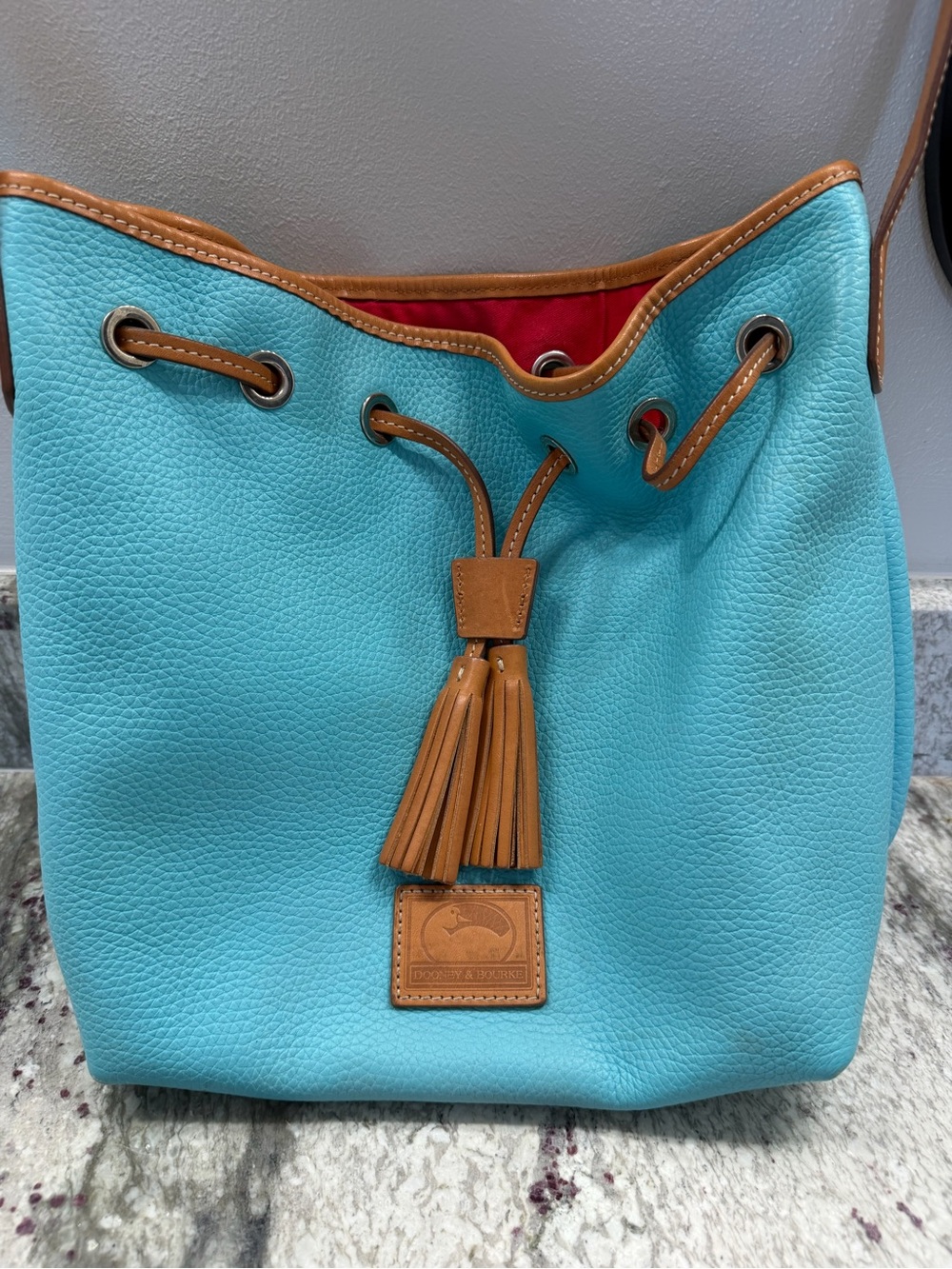 Dooney & Bourke Turquoise Pebbled Leather Drawstring Bucket Bag with Tan Trim